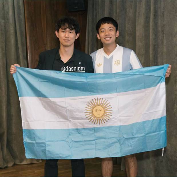 Dexter and a friend holding the Argentine flag