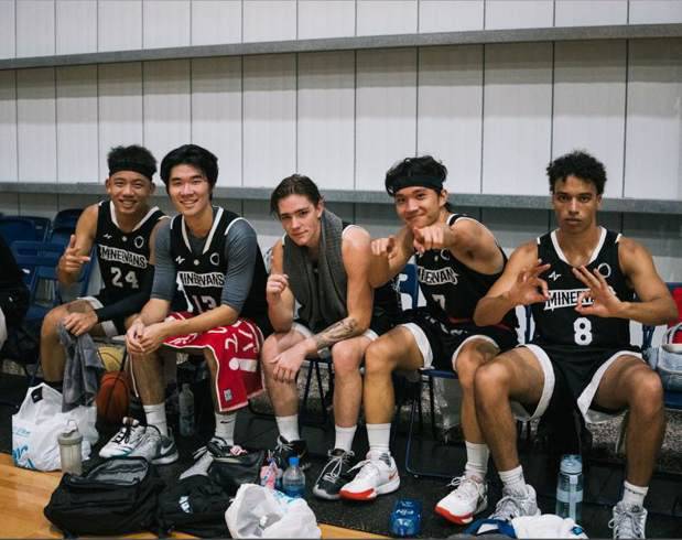 The Minerva basketball team in black jerseys