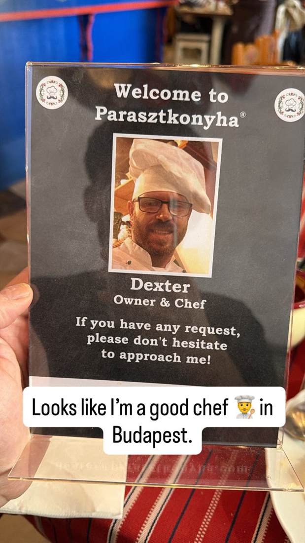 A restaurant menu card in Budapest that lists Dexter as owner and chef