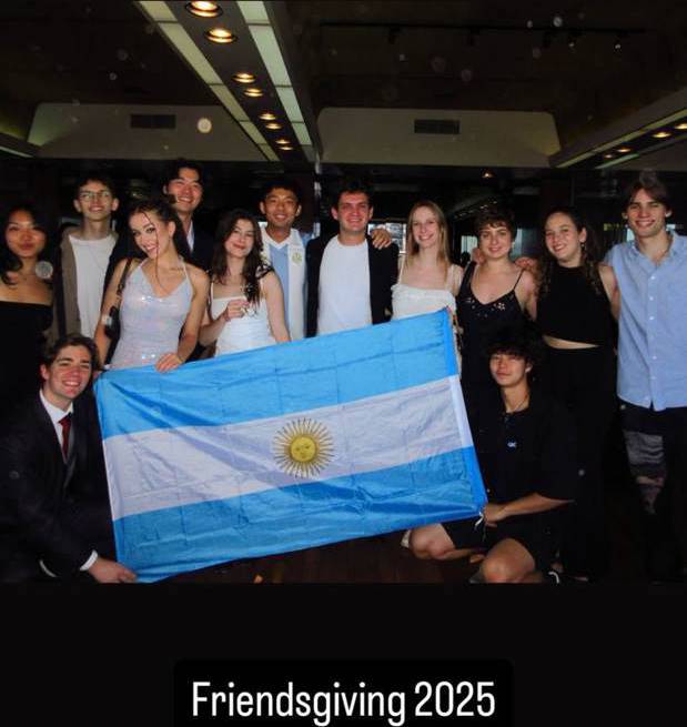 Friendsgiving 2025 group with the Argentine flag