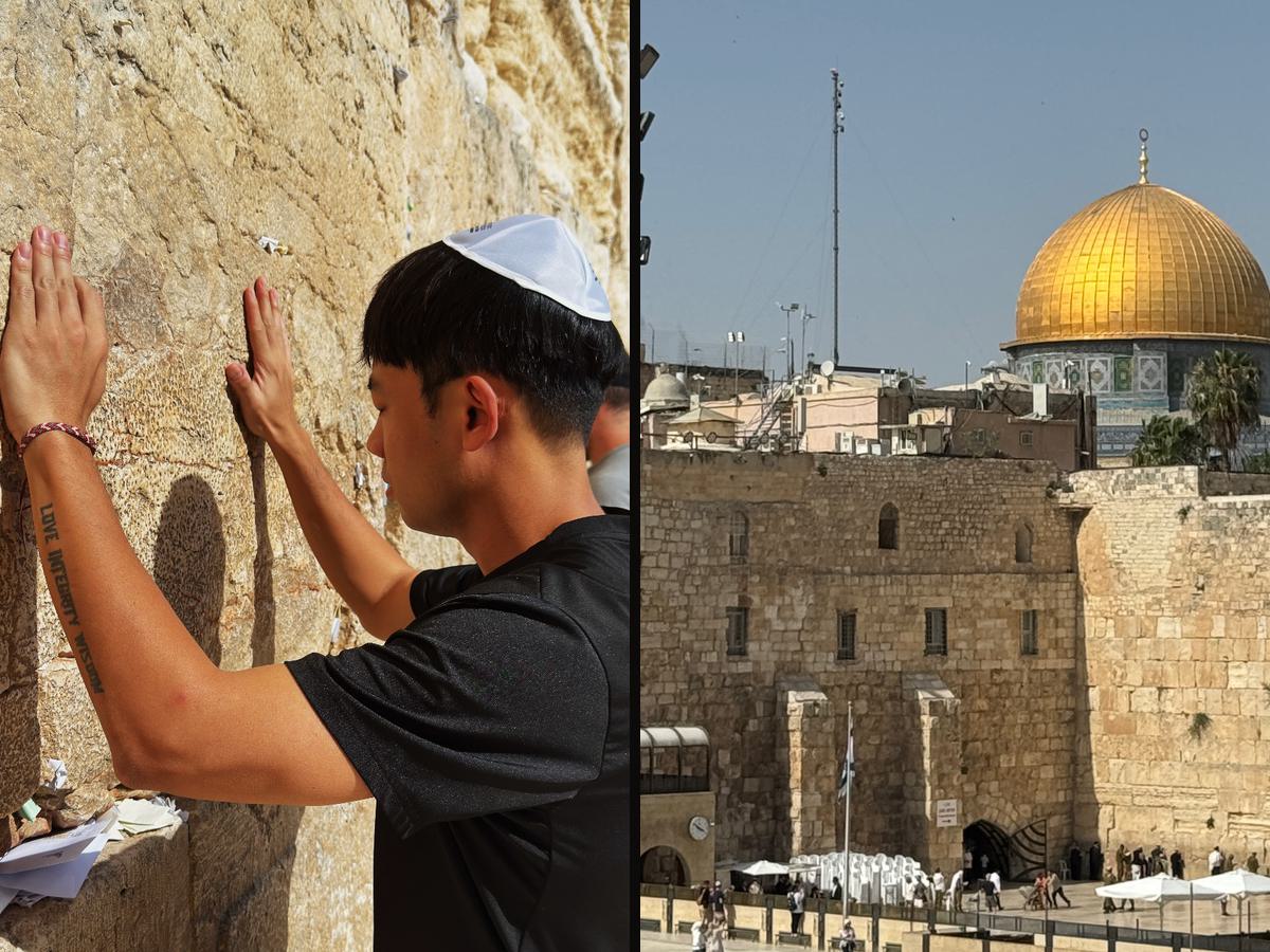 Dexter with his hand on the Western Wall, and the Dome of the Rock above the Old City of Jerusalem