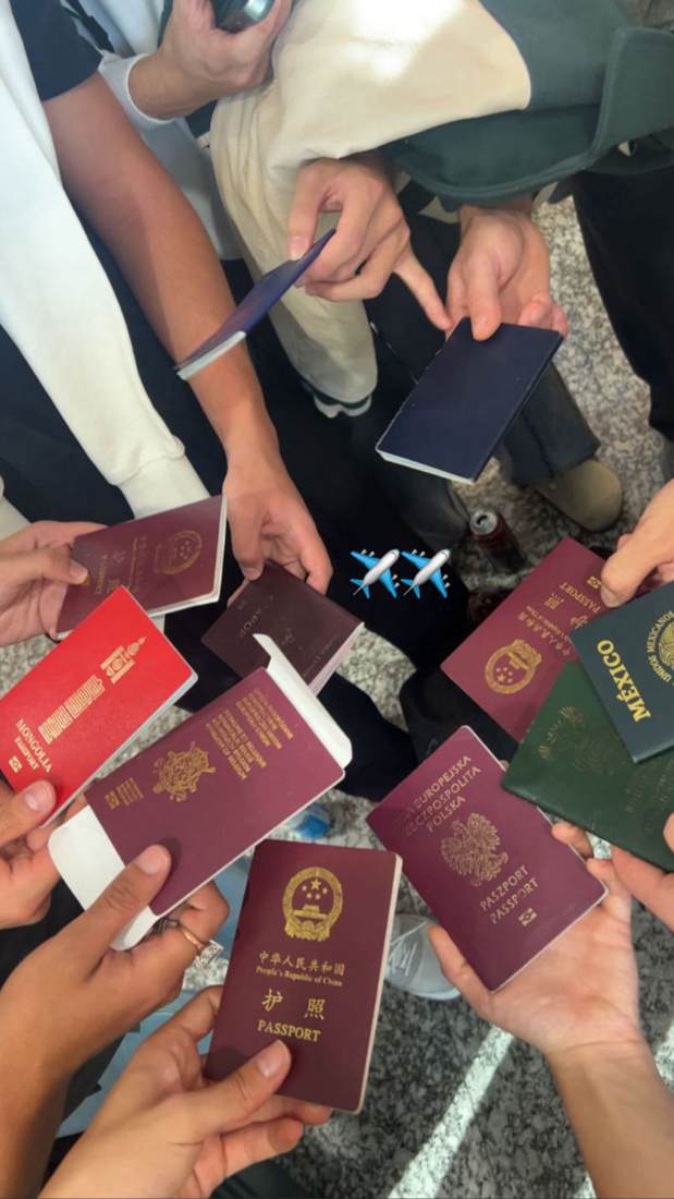 Passports from many countries held together in a circle