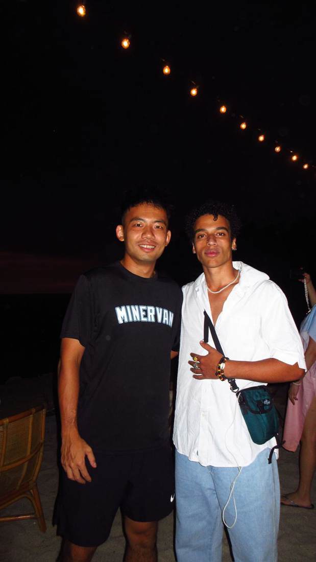Dexter in a Minerva shirt with a friend at night
